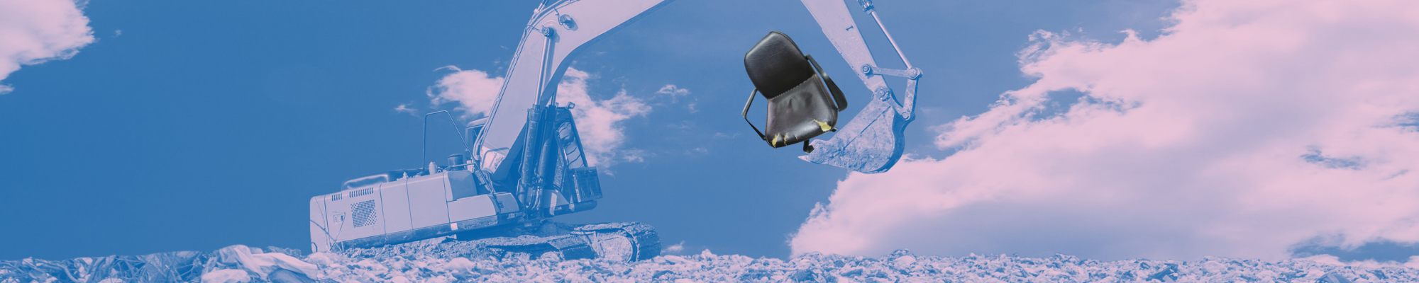 A digger picking up an old office chair at the landfill site